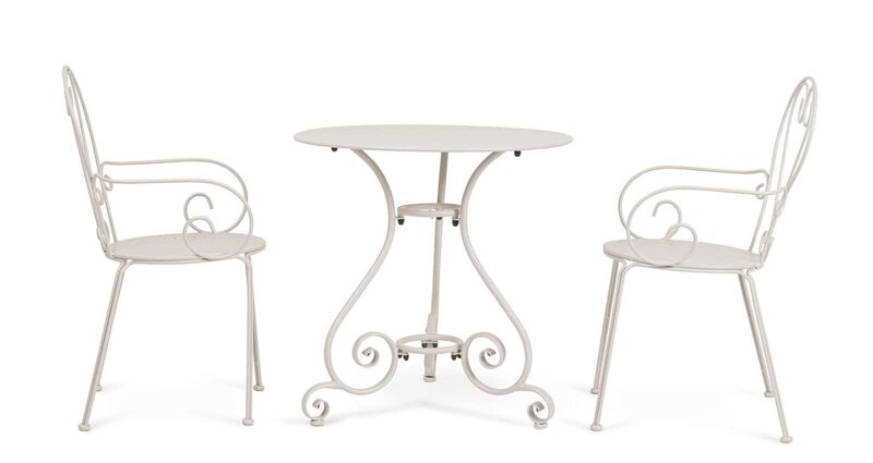 Immagine di tavolo e sedie stile vintage in ferro battuto bianco, ideale per ambienti esterni e giardini.