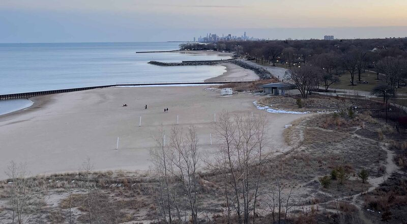 A view of Clark St. Beach with the Chicago skyline in the background