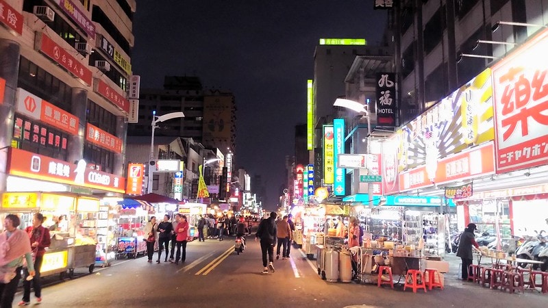 People walking through the Liuhe Night Market 