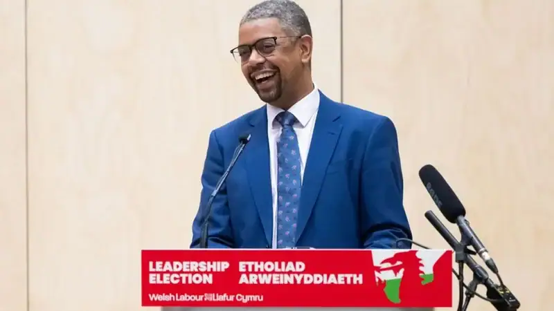 Wales Get First Black Leader Vaughan Gething _132938977_gethingpodium.jpg