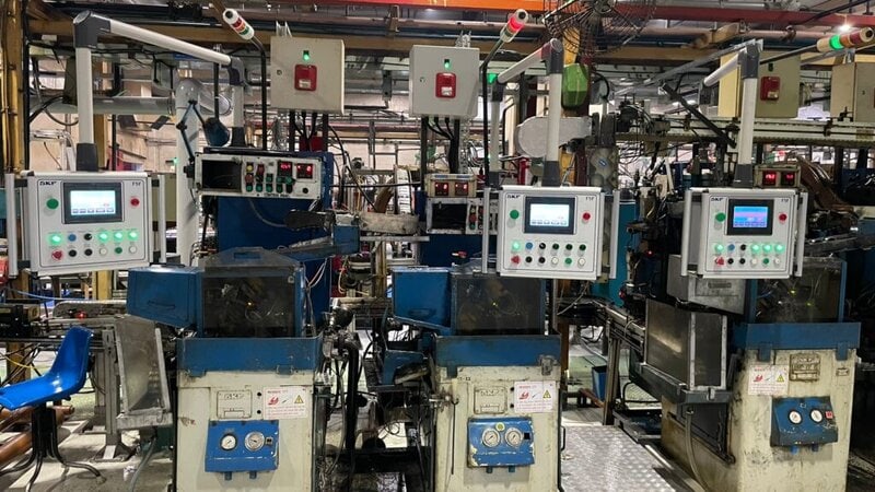 HMI support system mounted on industrial machine with control panel interface