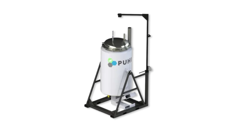 An image of a pyrolysis batch reactor. The reactor is green with a multicoloured PUHI logo on the side.