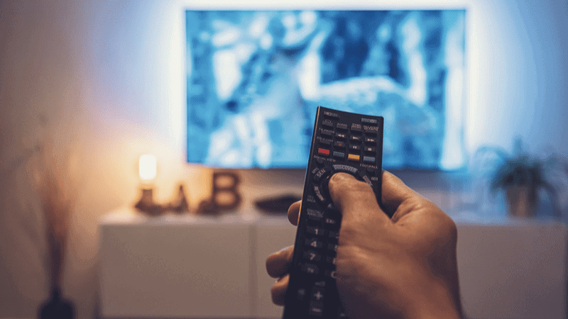 A man watching a movie in his living room