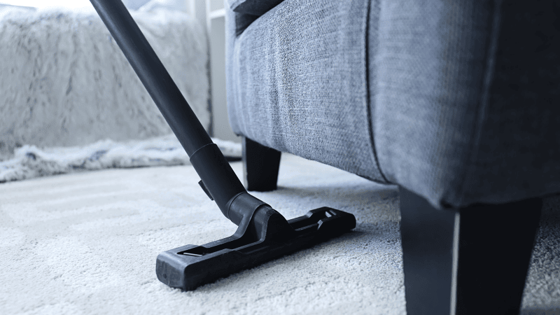 A woman cleaning up her room