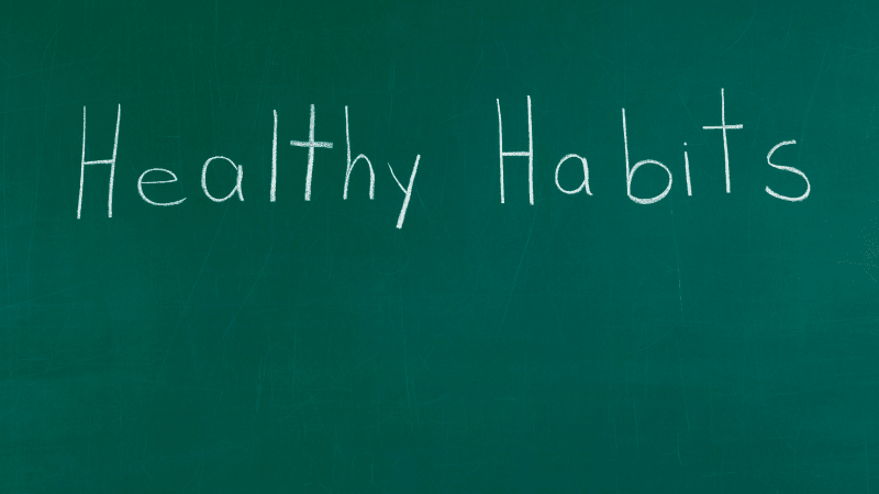 The words healthy habits written on a blackboard
