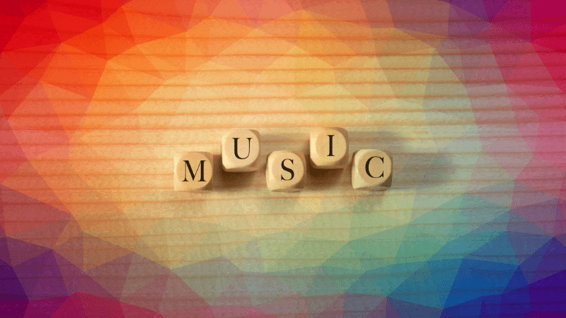 The word music spelled out with scrabble tiles