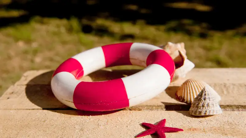 A hand holding a found object, encouraging creative exploration.