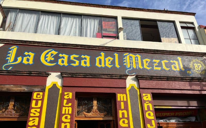 outdoor sign for La Casa del Mezcal, one of the best Oaxaca mezcalerias 