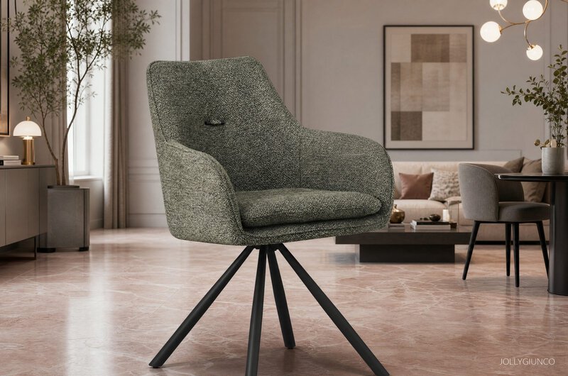 Green patterned armchair as the focal point in a modern living room with plants, a sofa, and framed art in the background.