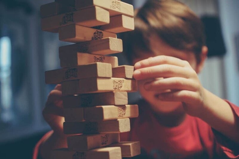 child playing board game in a family vacation rental