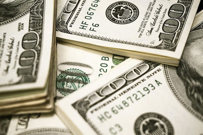 pile of 100 dollar bills
