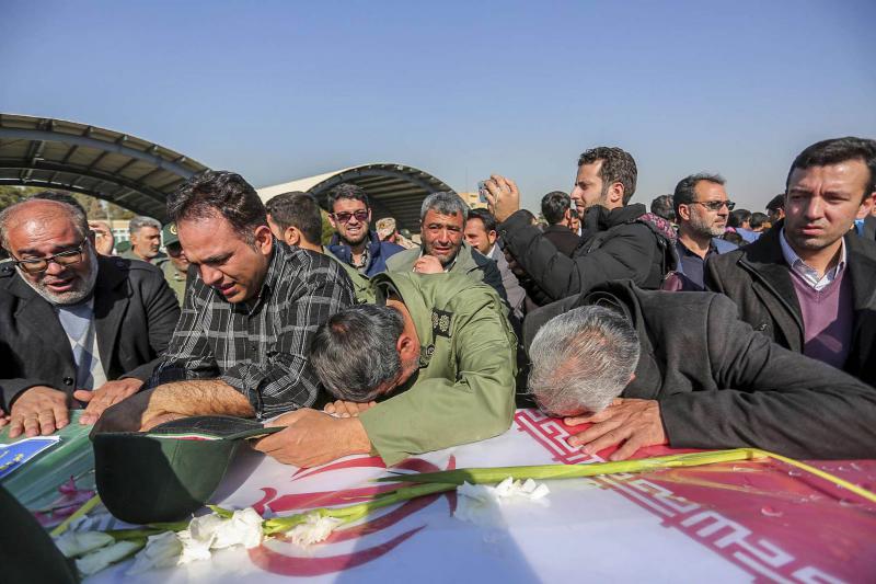 A 2019 file picture shows mourners weep over a flag-draped coffin of a member of Iran’s Revolutionary Guards who was killed in a suicide car bombing claimed by Jaish al-Adl, in southeastern Sistan and Baluchistan province.