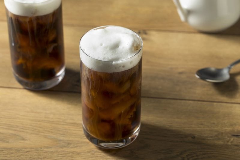 toasted marshmallow cold foam on a glass of iced coffee