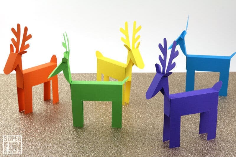 five printable paper reindeer in shades red, yellow, blue, turquoise and green