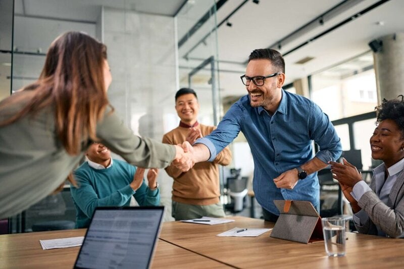 Healthcare administrators or doctors discussing MSO and ACO medication cost reduction