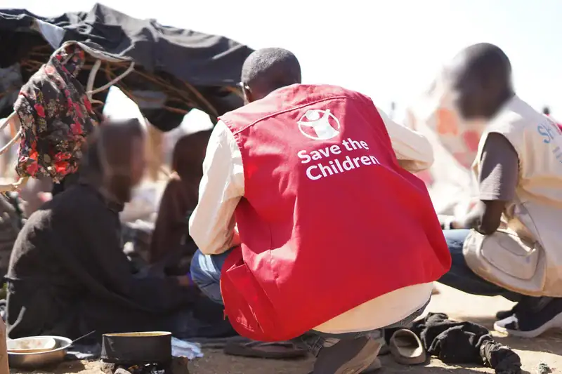 Save the Children staff talk to families forced to flee brutal violence in El Fasher, now living in precarious conditions in a displacement camp.