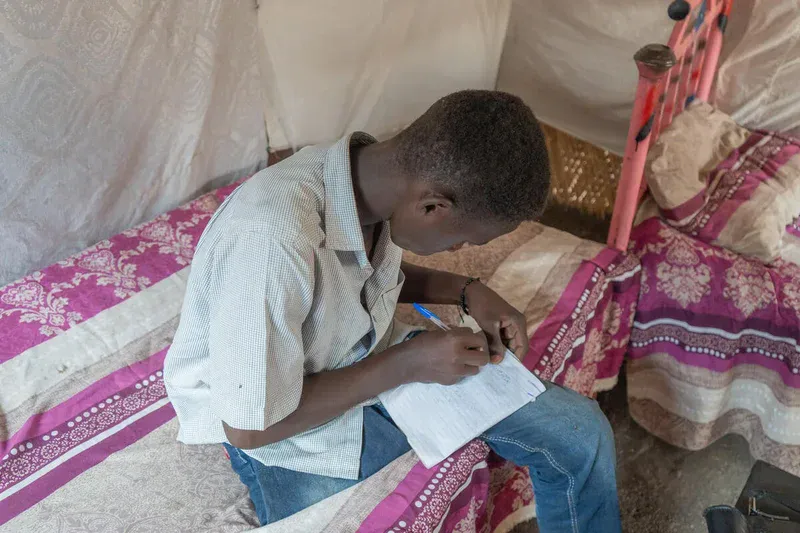 Ali 13 was injured by a blast whilst out playing football with his younger brother in Khartoum