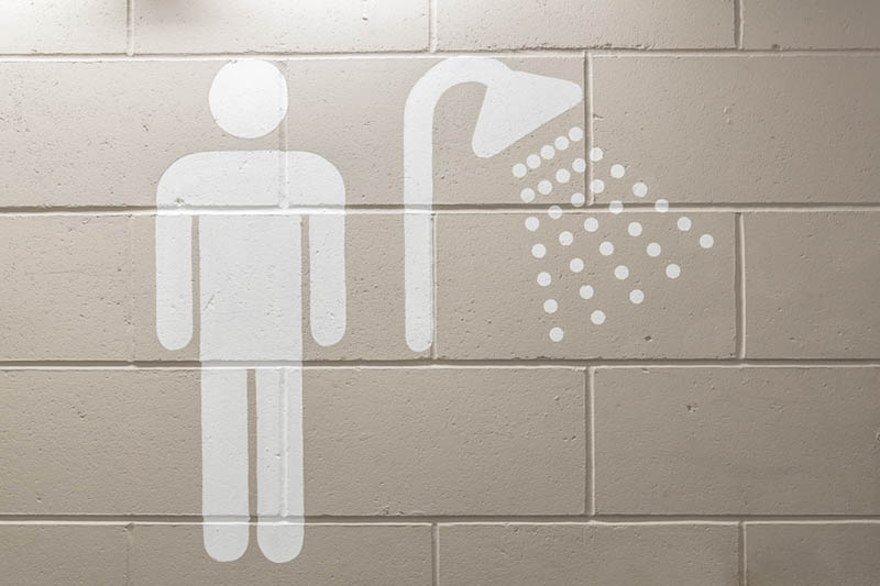 Supergraphic male bathroom identity sign painted onto the walls in the back office areas in 20 Fenchurch St