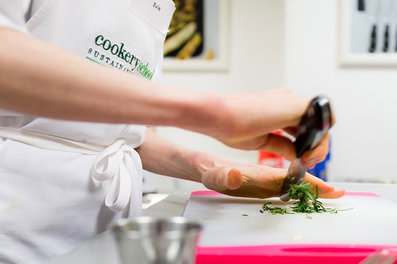 Cookery School London chopping herbs