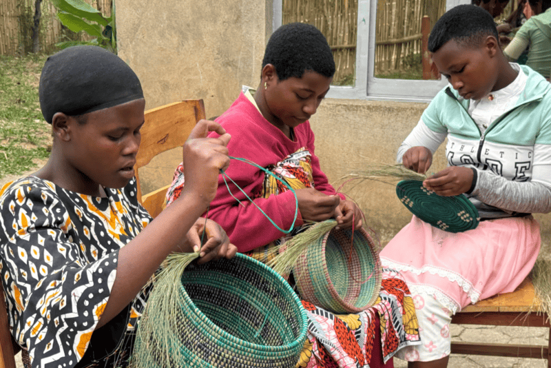 Participant proudly presenting her handmade craft.