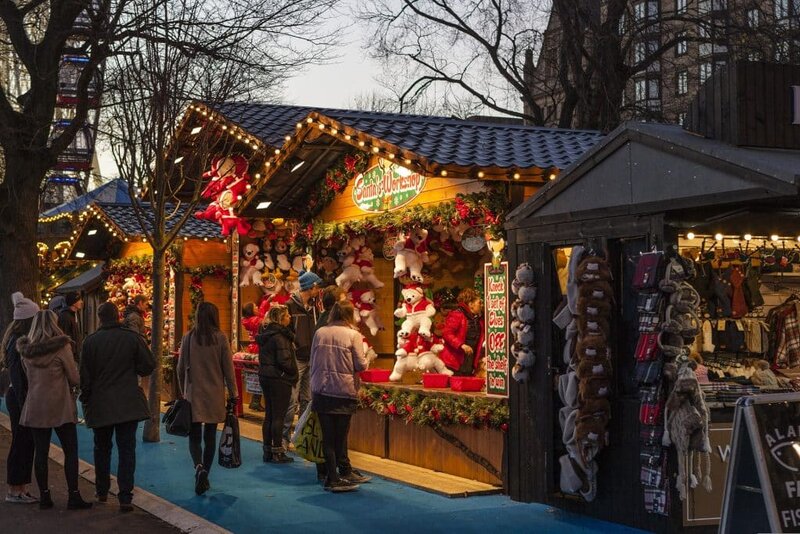 Christmas market booths at dusk