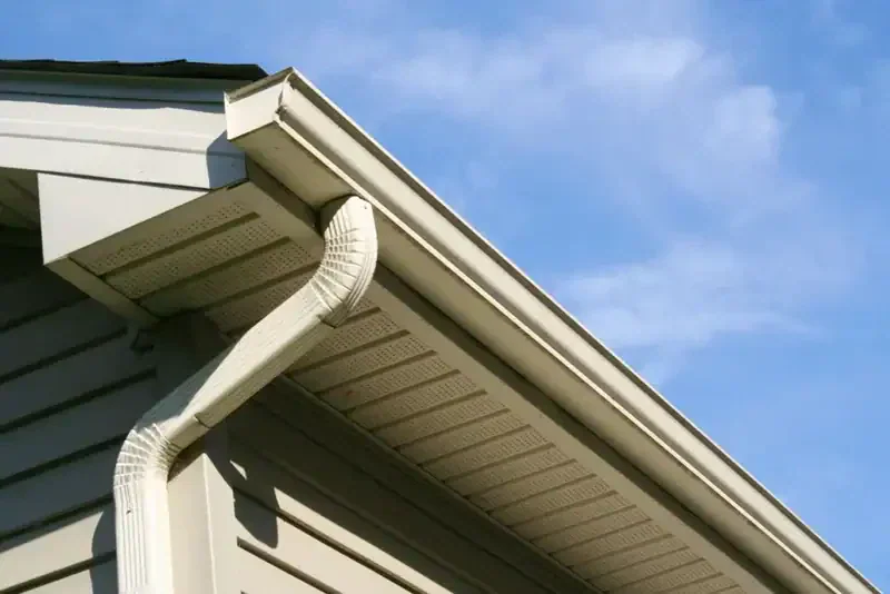 White eavestrough, downspout and fascia on a home