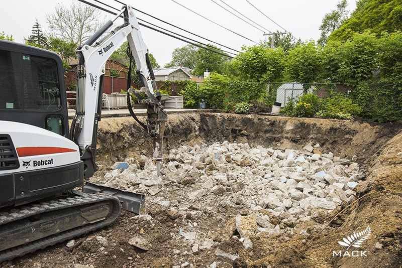 Mack Land Low Impact Pool Removal - Concrete is processed onsite into structural fill.