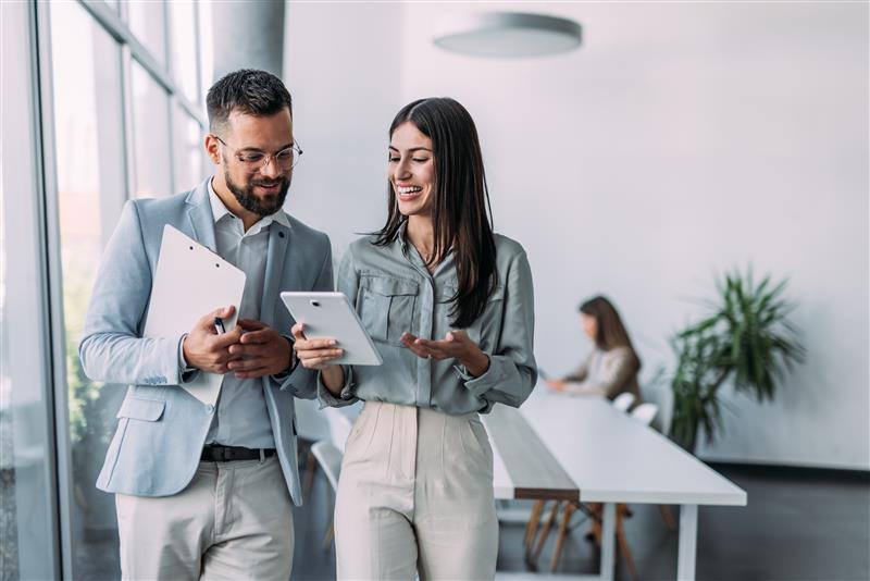 two friends working together in the office