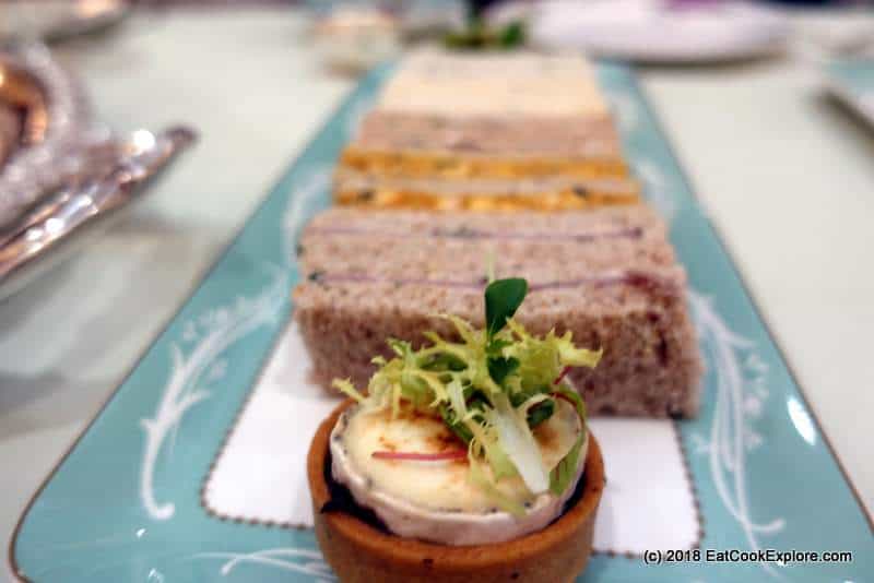 Goats cheese tart and finger sandwiches at the Savoy Hotel Afternoon Tea Goats cheese tart and finger sandwiches at the Savoy Hotel Afternoon Tea