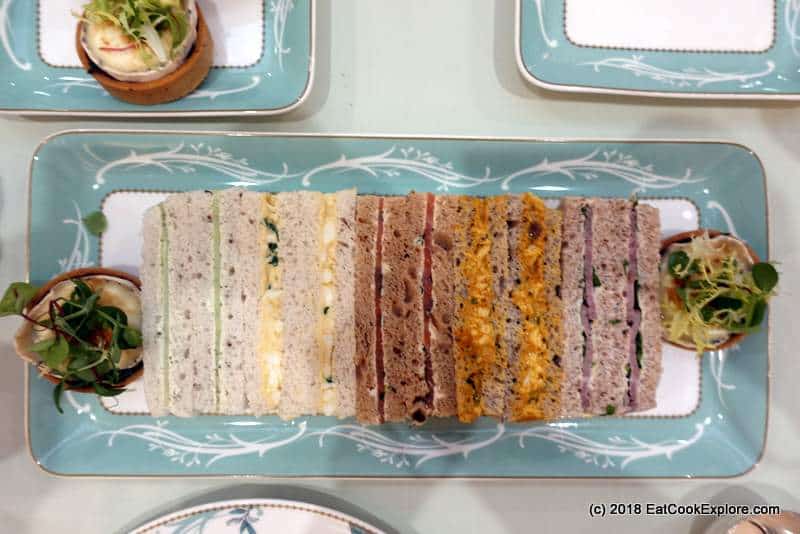 Goats cheese tart and finger sandwiches at the Savoy Hotel Afternoon Tea Goats cheese tart and finger sandwiches at the Savoy Hotel Afternoon Tea