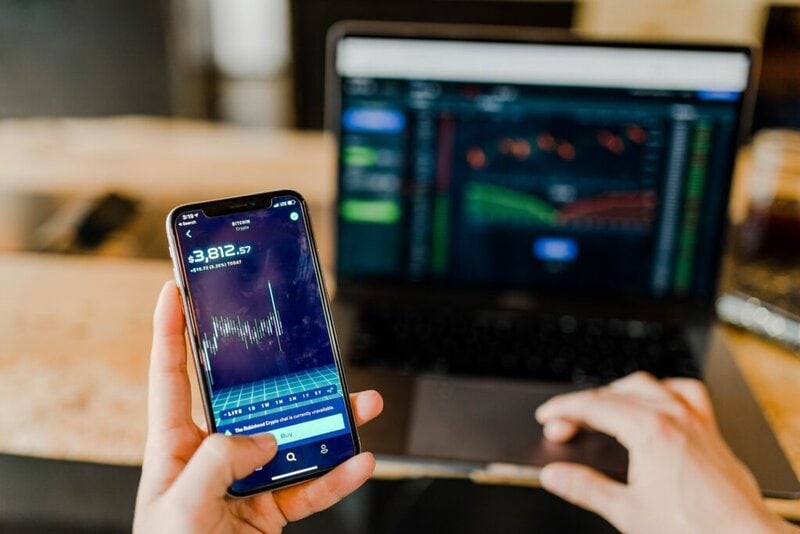 Investing in Notes and Mortgages cell phone and laptop