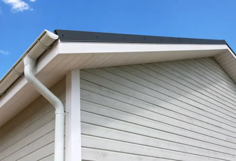 Vinyl siding, fascia and eavestrough on the side of a house