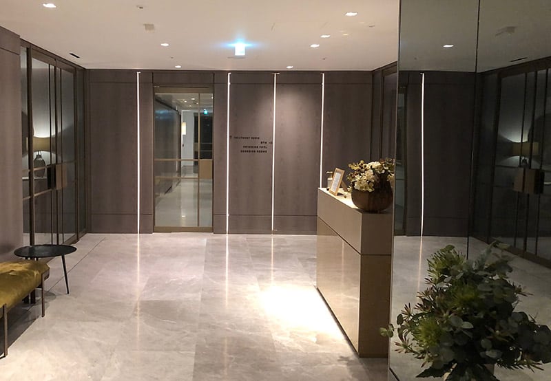 Directional prompt signs applied to the wall in Regent's Crescent Apartments