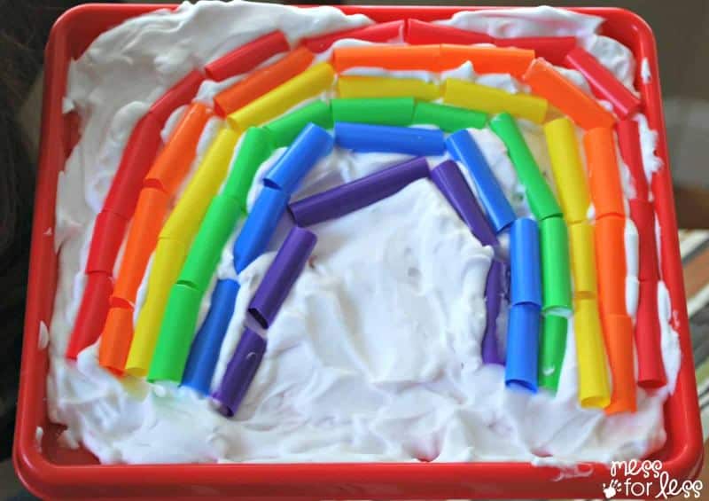 rainbow made of straws in shaving cream