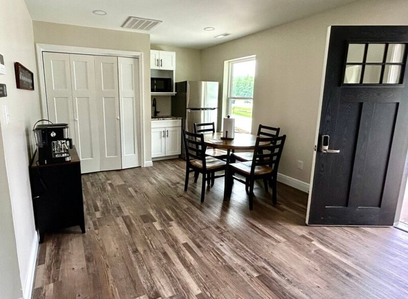 Cottage interior with kitchenette and dining area at Romaine Valley Weddings & Events in Fenton, Missouri