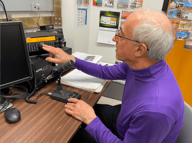 man operates ham radio at Northwestern
