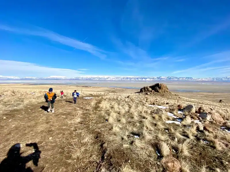 Kids running through Antelope island state park utah