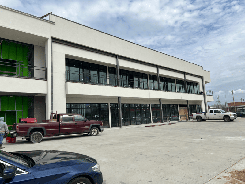 Professional multi-story commercial steel erection project in Houston, TX, showcasing structural framing and architectural metalwork by WeldIT.