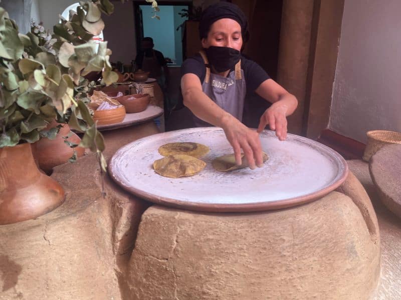 woman cooking on comal in oaxaca