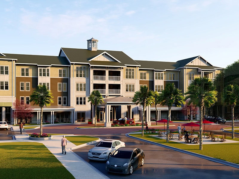 Four-story senior living apartment building at The Grove at Coastal Grand in Myrtle Beach, SC