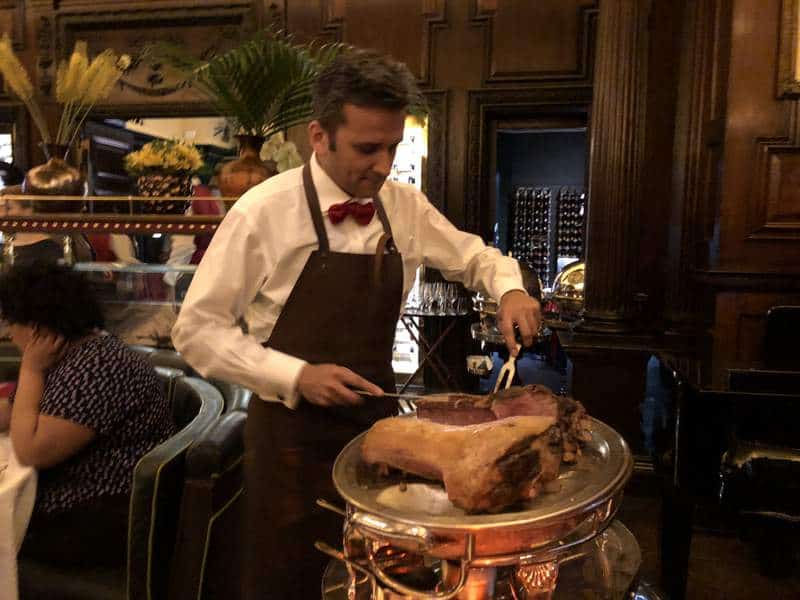 Roast lamb on a carving trolley