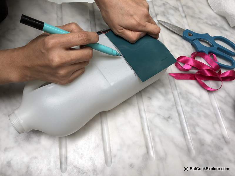 Use a template to draw the line to cut the bottle.
