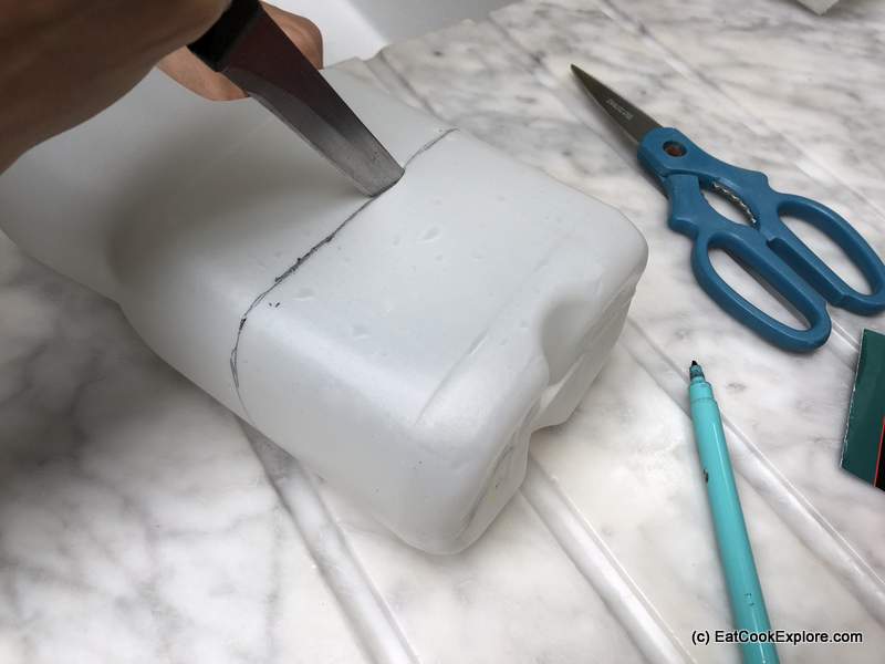 Then using a Stanley knife or sharp kitchen knife, cut a slit to start. You can then use a pair of kitchen scissors to cut along the line you drew.