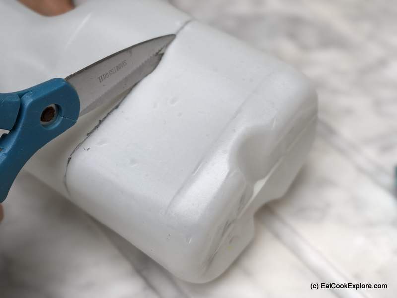 Then using a Stanley knife or sharp kitchen knife, cut a slit to start. You can then use a pair of kitchen scissors to cut along the line you drew.