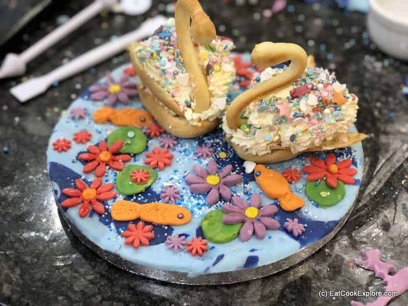 How to make choux pastry swans 5 Choux pastry swans on a fondant icing pond