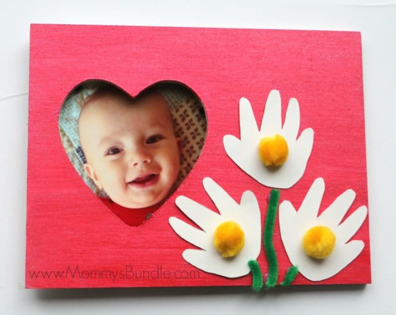 frame decorated with baby handprints