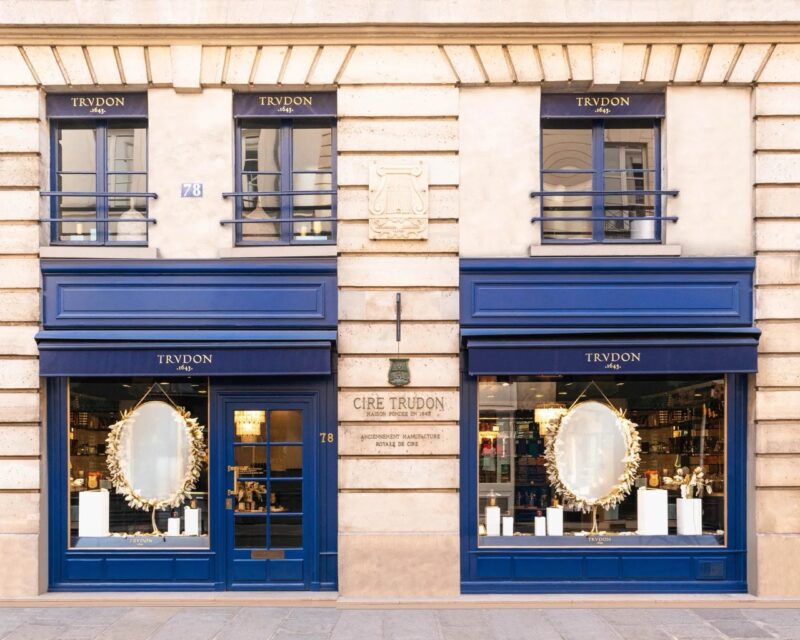 Classic blue façade of the Trudon perfume and candle boutique in Paris. french perfume shops in paris