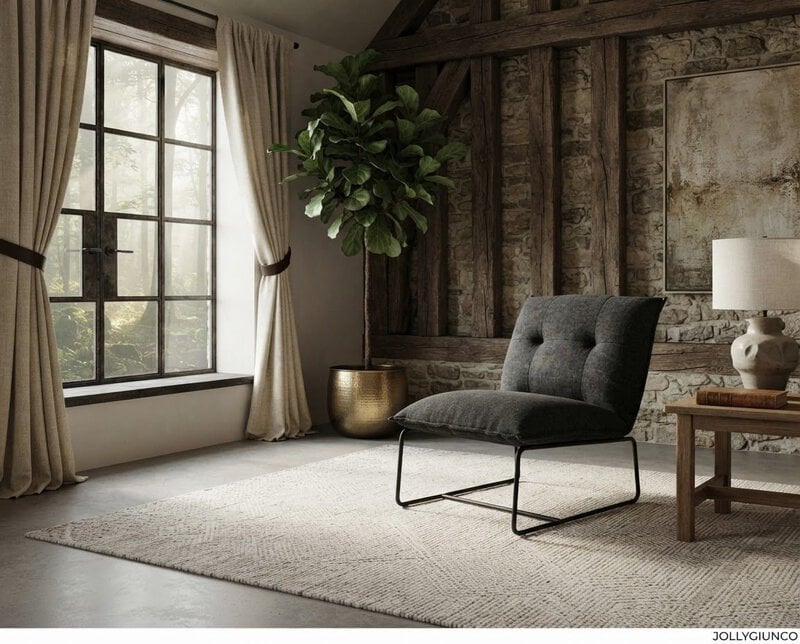 Cozy living room corner with a gray upholstered lounge chair, rug, and wooden-beamed stone wall under natural light from a large window.