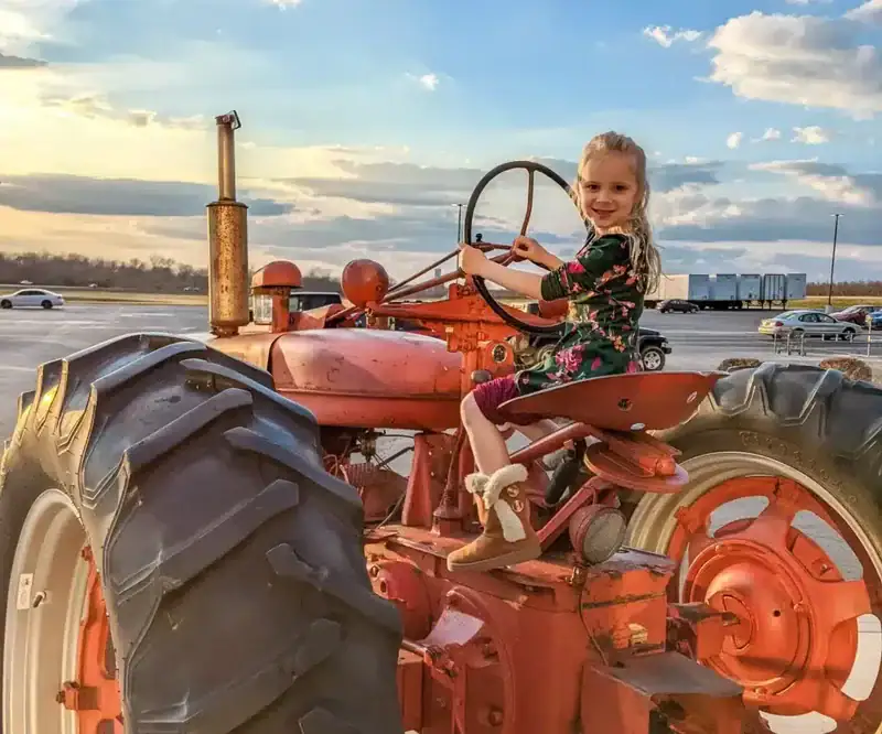 Tractor with kids play in front of Eckert's country store