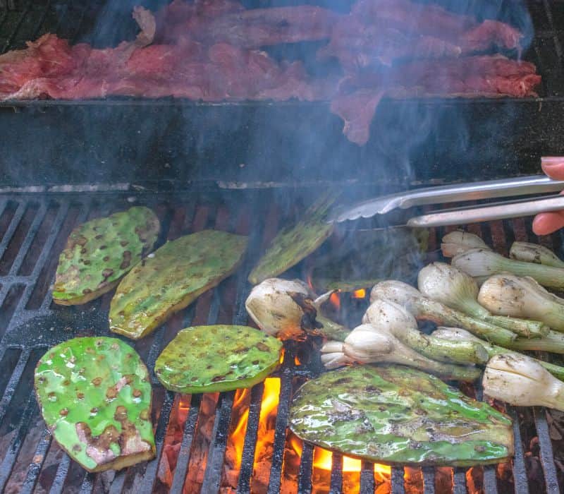 grilling nopal (cactus) and meat in oaxaca mexico